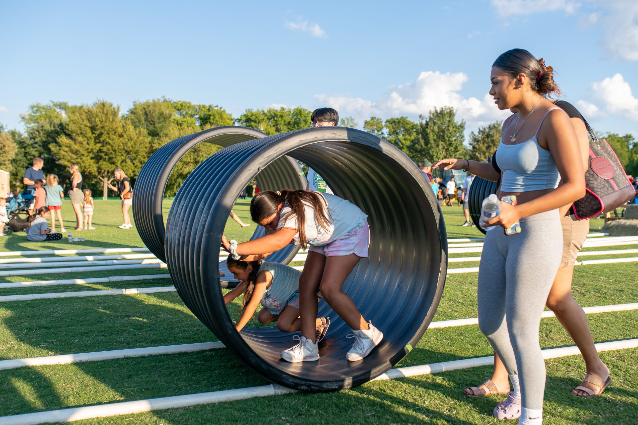 Child running in tube through an obstacle course 